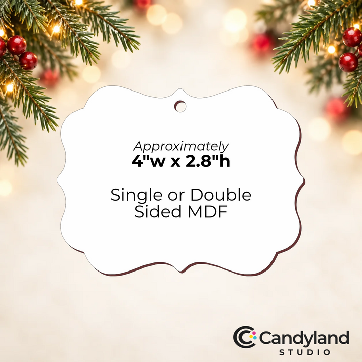 a white ornament with a curved shape, placed against a blurred background with Christmas lights and pine branches.