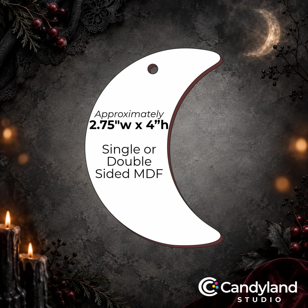 a crescent moon-shaped ornament with a candle and berries in the background.