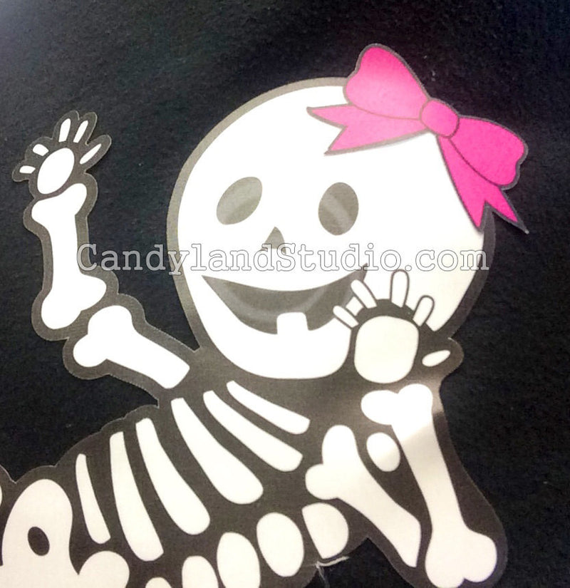 Add a hair bow to your baby skeleton